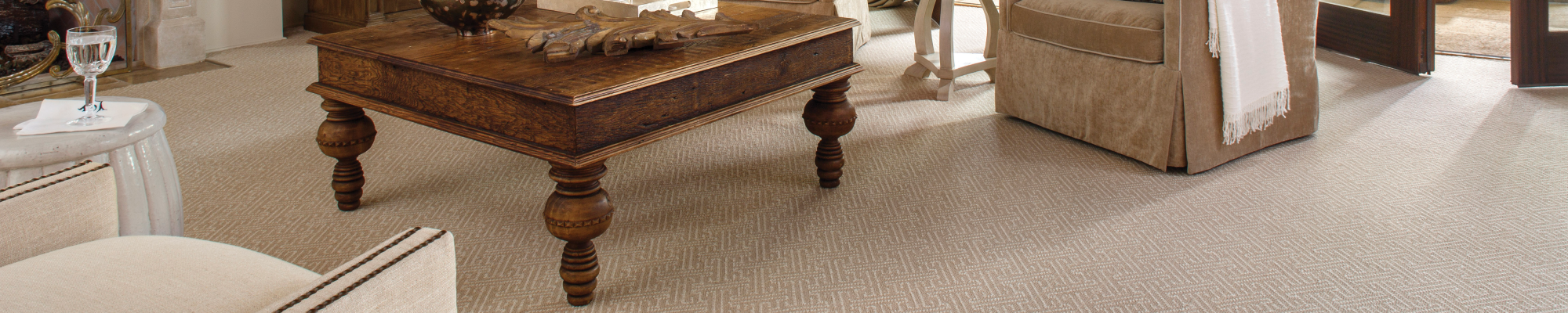 Living Room Area With Chairs And Couch On Carpeted Flooring